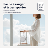 Housse ronde grise du coussin de voyage, compacte et légère, avec poignée.